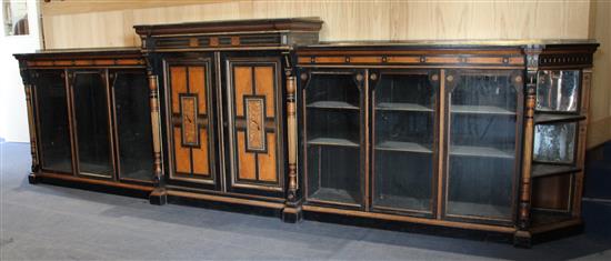 Lamb of Manchester. A Victorian Aesthetic period dwarf library bookcase, W.14ft 7in. D